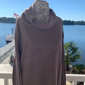 Women’s soft turtleneck. Light chocolate. Side detail. Luxurious feel. Smokefree